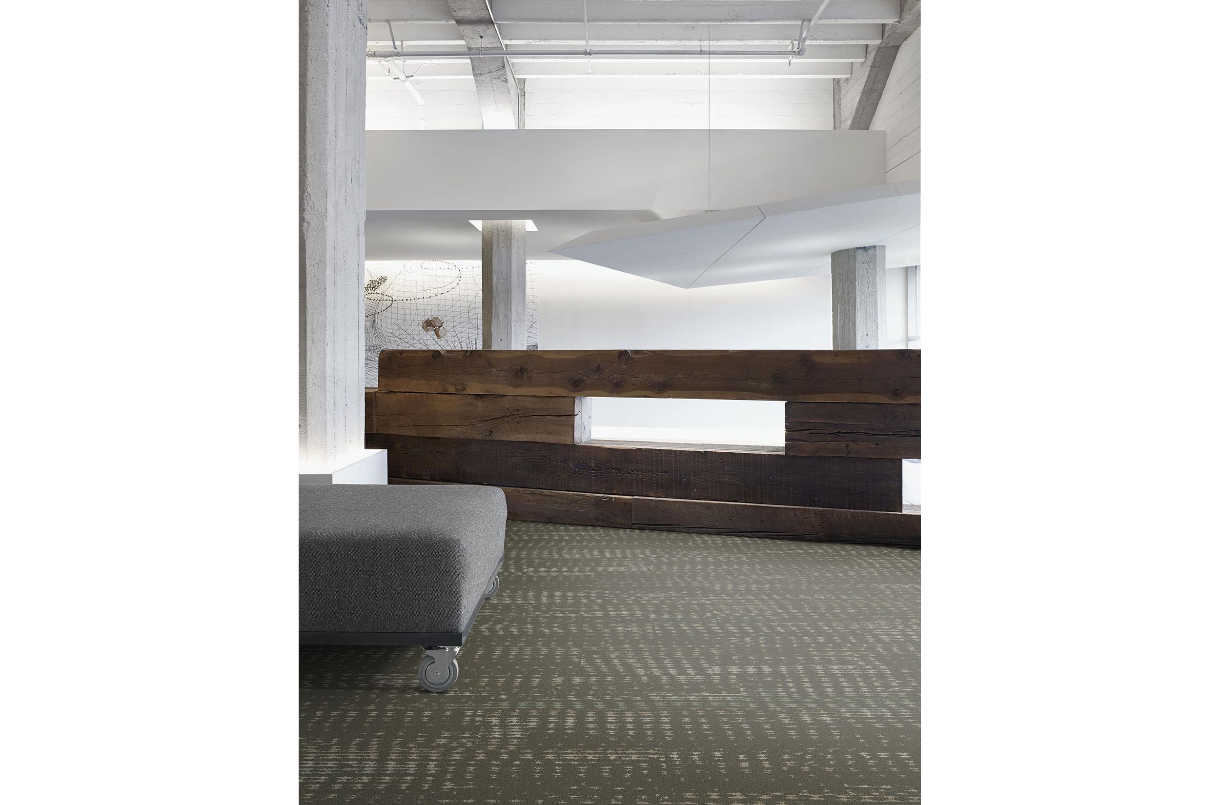 Interface Aquatint plank carpet tile in lobby with gray ottoman and wood desk image number 2